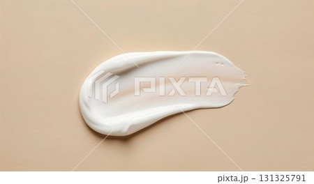 A white cream set on a beige background, highlighting its use in skincare and self-care routines A white cream set on a beige background, highlighting its use in skincare and self-care routines 131325791