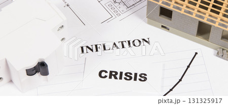 Inscriptions crisis and inflation with electric fuse, small house under construction Inscriptions crisis and inflation with electric fuse, small house under construction 131325917