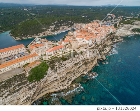 Aerial view marina cape Bonifacio south Corsica France citadel on rocky promontory on wild white limestone cliffs Aerial view marina cape Bonifacio south Corsica France citadel on rocky promontory on wild white limestone cliffs 131326024
