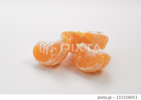 Half of peeled tangerine or mandarin fruit on white background isolated Half of peeled tangerine or mandarin fruit on white background isolated 131326051