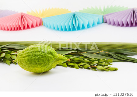 Sukkot Celebration Decor. A vibrant Sukkot setup featuring a lulav, etrog Sukkot Celebration Decor. A vibrant Sukkot setup featuring a lulav, etrog 131327616