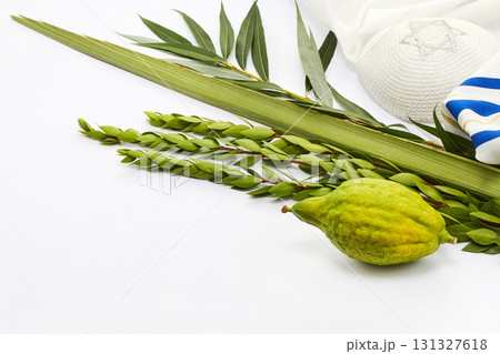 Sukkot Celebration Set. Sukkot ritual items including etrog, lulav, myrtle, willow, and kippah 131327618