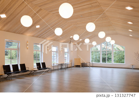 A Modern Hall Featuring Elegant Lighting Along with Beautiful Scenic Views in the Surroundings 131327747