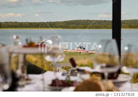 Enjoy Elegant Dining with Breathtaking Views of Serene Waters and the Scenic Landscape 131327816