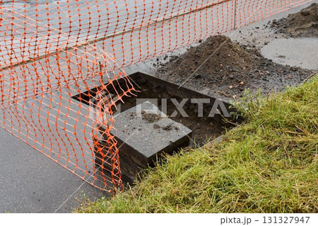 Construction Site with Safety Barriers, Excavation Work, and Ongoing Development Activities Construction Site with Safety Barriers, Excavation Work, and Ongoing Development Activities 131327947