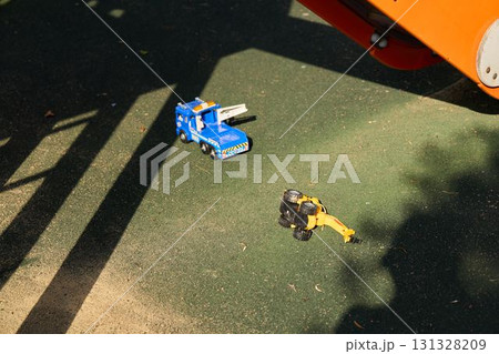 Brightly Colored Toy Trucks on the Playground Surface Ready for Fun and Adventure 131328209