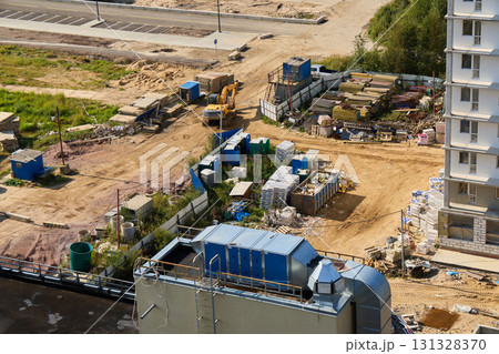 Developing construction sites entails using heavy machinery along with necessary materials 131328370