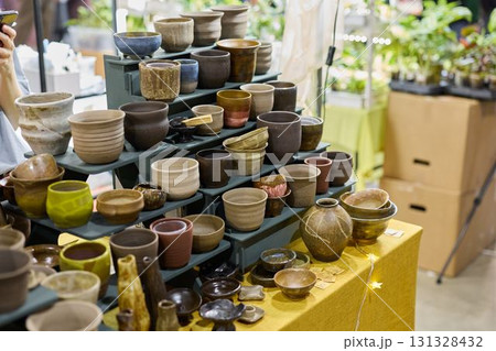 An Exquisite and Colorful Handmade Pottery Display Located at a Vibrant Craft Market 131328432