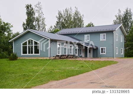 A Modern Green House featuring a Spacious and Open Design surrounded by Natures Beauty A Modern Green House featuring a Spacious and Open Design surrounded by Natures Beauty 131328665