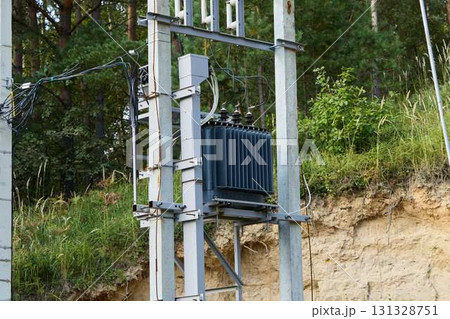 Installing power transformers is vital for ensuring a reliable electricity supply in nature Installing power transformers is vital for ensuring a reliable electricity supply in nature 131328751