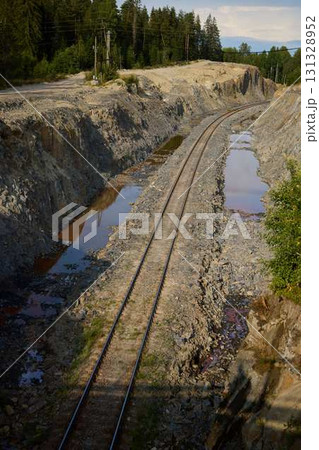 An Abandoned Railway Track that is Beautifully Surrounded by Natures Intense Beauty An Abandoned Railway Track that is Beautifully Surrounded by Natures Intense Beauty 131328952