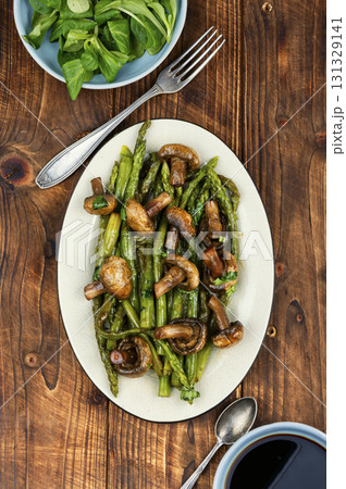 Baked asparagus spears with mushrooms. Baked asparagus spears with mushrooms. 131329141
