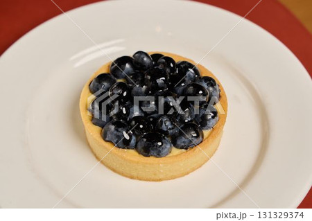 Savor the Delicious Blueberry Tart that features Fresh Berries for a delightful treat Savor the Delicious Blueberry Tart that features Fresh Berries for a delightful treat 131329374