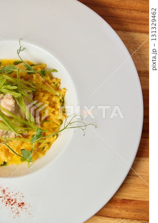 A Delicious and Flavorful Pasta Dish Beautifully Garnished with Fresh Green Herbs A Delicious and Flavorful Pasta Dish Beautifully Garnished with Fresh Green Herbs 131329462