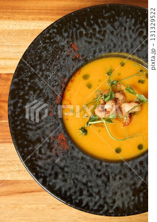 A truly Delicious Gourmet Soup served elegantly in a classy Black Bowl perfect for dining 131329522