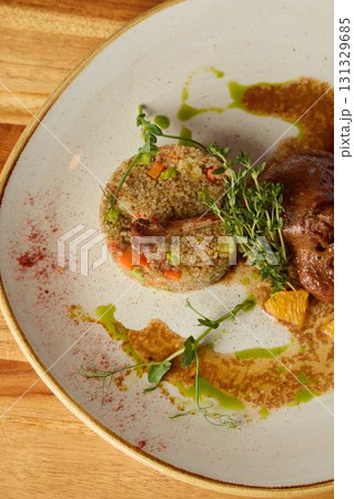 A Gourmet Dish featuring Colorful Fresh Vegetables accompanied by a sauce served on an Elegant Plate A Gourmet Dish featuring Colorful Fresh Vegetables accompanied by a sauce served on an Elegant Plate 131329685