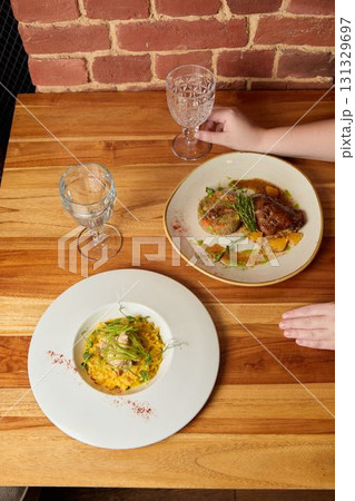 The experience of delicious dining showcases an exquisite and elegant plating style that captivates 131329697