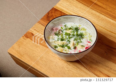 Indulge in a Delicious Bowl of Fresh, Creamy Soup Elevated with Aromatic Herbs and Fresh Vegetables Indulge in a Delicious Bowl of Fresh, Creamy Soup Elevated with Aromatic Herbs and Fresh Vegetables 131329717