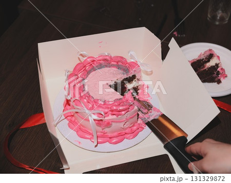 A Delicious and Beautifully Layered Cake with Pink Frosting Perfect for a Celebration Event 131329872