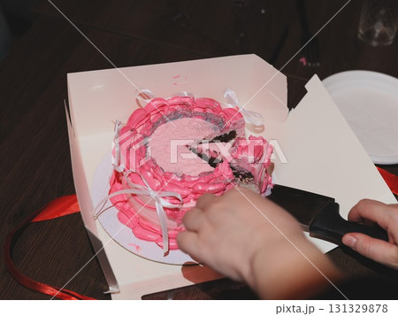 A Beautiful and Delicious Pink Cake is Being Cut and Served at a Special Celebration Event Today A Beautiful and Delicious Pink Cake is Being Cut and Served at a Special Celebration Event Today 131329878