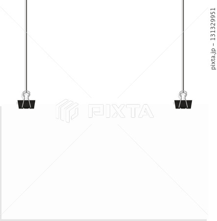 Blank white paper suspended by black binder clips hanging from a dark black background. 131329951