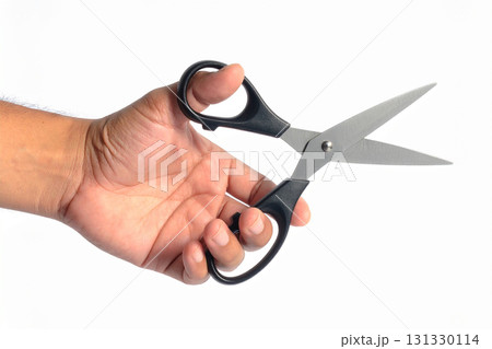 scissors in a man's hand scissors in a man's hand 131330114