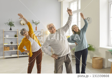 Sporty senior people exercising, doing fitness for health care of elderly people in geriatric club 131330608