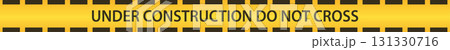 A yellow barrier tape indicating 'Under Construction Do Not Cross' with black stripes design. 131330716