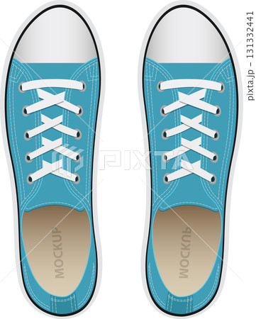 Pair of light blue canvas sneakers viewed from above. The footwear has white laces and accents. Pair of light blue canvas sneakers viewed from above. The footwear has white laces and accents. 131332441