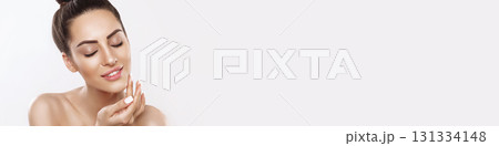 Skin Care. Woman With Beauty Face Touching Healthy Facial Skin Portrait. Beautiful Smiling Girl Model With Natural Makeup Touching Her Ski 131334148