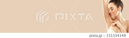 Woman Holding Her Arms Up And Showing Clean Underarms. Armpit Epilation, Laser Hair Removal.  Depilation  Smooth Clear Skin 131334149