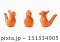 Orange terracotta clay bird whistle toy. Imitation of birdsong. 131334905
