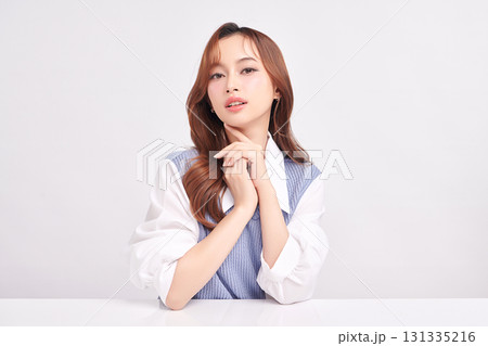 A beautiful young Asian woman with clean, fresh skin against a white background. Skincare, facial treatment, cosmetology, beauty, and spa. An elegant portrait of an Asian woman. A beautiful young Asian woman with clean, fresh skin against a white background. Skincare, facial treatment, cosmetology, beauty, and spa. An elegant portrait of an Asian woman. 131335216