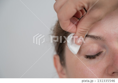 Caucasian woman getting eyebrow tinting procedure.  131335546