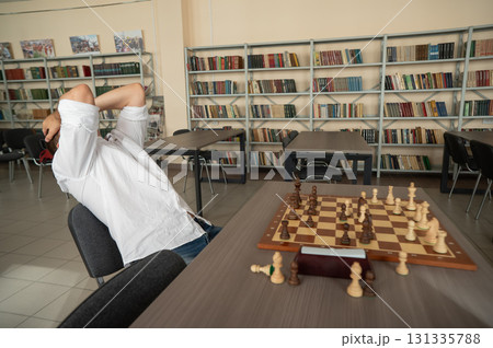 Caucasian man upset after losing chess game. Caucasian man upset after losing chess game. 131335788