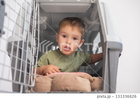 A small child in a closed cage. A small child in a closed cage. 131336826