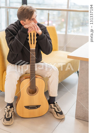 Caucasian man holding acoustic guitar. Caucasian man holding acoustic guitar. 131337194