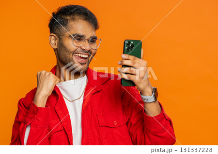 Happy excited winner man use smartphone celebrating success, winning play game, good lottery news Happy excited winner man use smartphone celebrating success, winning play game, good lottery news 131337228