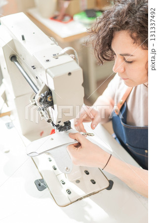 Woman tanner at work in the workshop.  131337492