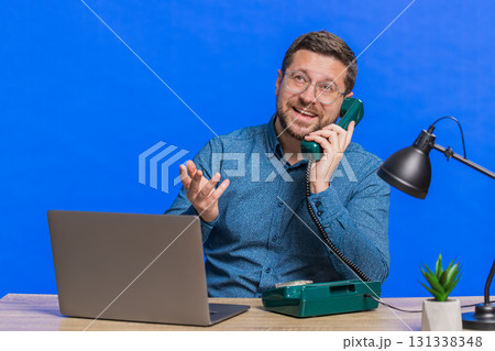Man having telephone conversation with client, call center or support service operator helpline Man having telephone conversation with client, call center or support service operator helpline 131338348