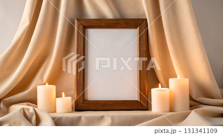 Elegant candle display with a wooden frame on a soft fabric background 131341109