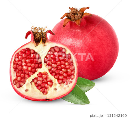 Pomegranate and a cut in a half isolated. Pink ripe pomegranates and green leaf with clipping path. Pomegranate and a cut in a half isolated. Pink ripe pomegranates and green leaf with clipping path. 131342160