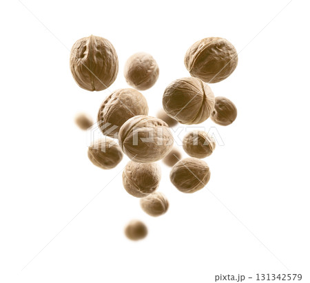 Whole walnuts levitate on a white background 131342579
