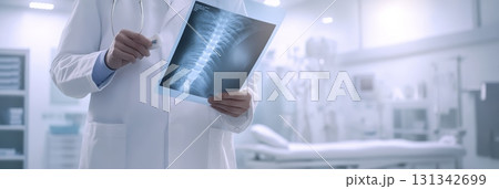 Doctor examining a spinal x ray in a bright hospital room, concentrating on patient diagnosis and treatment while utilizing advanced medical imaging techniques for accurate analysis 131342699