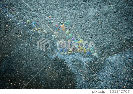 Colorful wax drippings melting on rough asphalt surface. Colorful wax drippings melting on rough asphalt surface. 131342707
