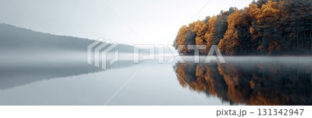 Golden autumn trees lining a misty lake at dawn, creating a serene and colorful reflection on the calm water surface, embodying the tranquil beauty of the season Golden autumn trees lining a misty lake at dawn, creating a serene and colorful reflection on the calm water surface, embodying the tranquil beauty of the season 131342947