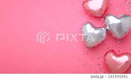 Heart shaped balloons in pink and silver floating on a pink background with confetti create a festive atmosphere, perfect for valentine's day, anniversaries, or romantic celebrations 131343341