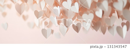 Hanging paper hearts with delicate folds against a soft pastel pink backdrop create a romantic atmosphere ideal for valentine's day and celebrations of love 131343547