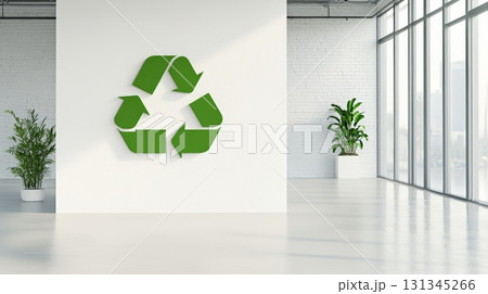 Large green recycle symbol displayed on a white wall in a modern office space with large windows and potted plants, promoting sustainability and waste management Large green recycle symbol displayed on a white wall in a modern office space with large windows and potted plants, promoting sustainability and waste management 131345266