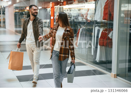 In the mall with clothes. Young couple are in supermarket together 131346066